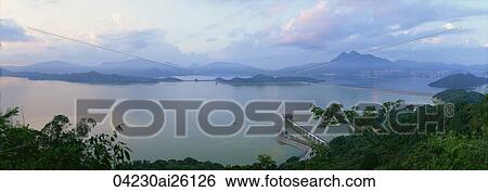 Stock Photograph - Plover Cove Reservoir at dawn, Hong Kong. Fotosearch