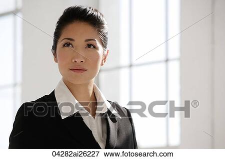 Portrait of businesswoman looking away View Large Photo Image Stock Photo - Portrait of businesswoman looking away. Fotosearch