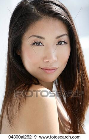 Stock Photo - Portrait of young woman smiling. Fotosearch