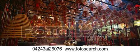 Spiral incense in Man Mo Temple, Central, Hong Kong View Large Photo Image Stock Photograph - Spiral incense in Man Mo Temple, Central, Hong Kong. Fotosearch