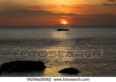 Stock Image - Sunset over Eagle Point, Sepok Island, Philippines. Fotosearch