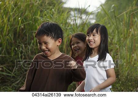 Stock Photo - Three children playing.. Fotosearch