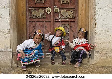 Tibetan girls posing at the door of Songzanlin Temple, shangri la, shangrila, China View Large Photo Image Stock Image - Tibetan girls posing at the door of Songzanlin Temple, shangri la, shangrila, China. Fotosearch