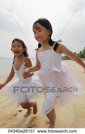 Two girls running together. View Large Photo Image Stock Image - Two girls running together.. Fotosearch