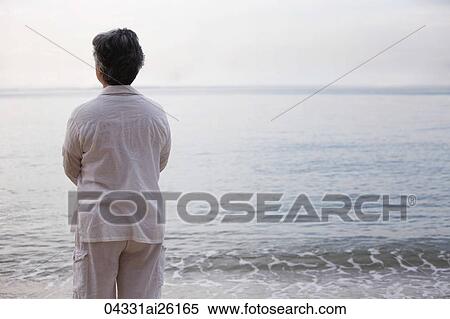 Stock Photography - Women looking at ocean.. Fotosearch