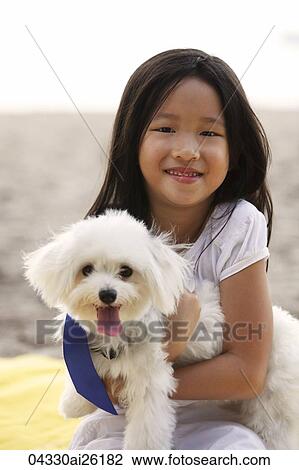 Young girl hugging dog. View Large Photo Image Stock Image - Young girl hugging dog.. Fotosearch