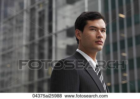 Stock Photo - business man in a suit looking away. Fotosearch
