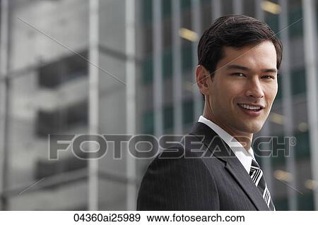 Stock Photo - "business man in a suit, smiling at camera". Fotosearch