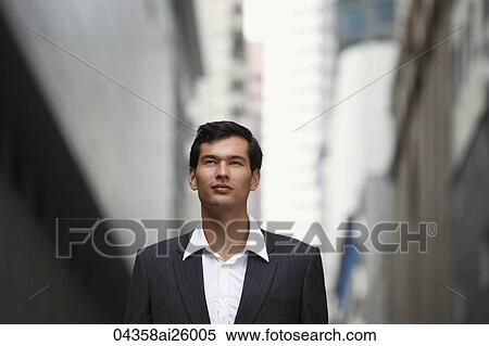 Stock Photography - businessman looking up. Fotosearch