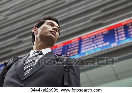 businessman standing before stock exchange View Large Photo Image Stock Photography - businessman standing before stock exchange. Fotosearch