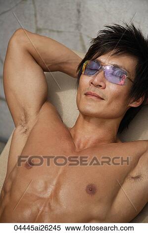 Man lying in the sun View Large Photo Image Stock Photography - Man lying in the sun. Fotosearch