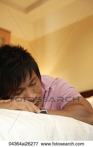 Stock Photo - Man sleeping. Fotosearch