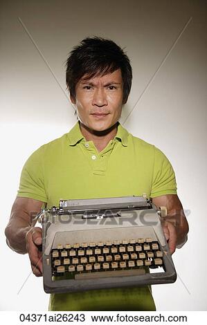 Stock Image - Man with type writer. Fotosearch