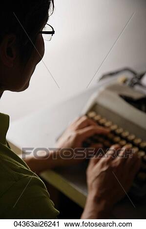 Stock Image - Profile of man at type writer. Fotosearch