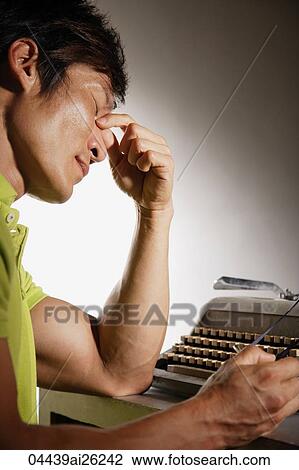 Profile of man at type writer View Large Photo Image Stock Image - Profile of man at type writer. Fotosearch