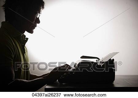 Profile of man at type writer View Large Photo Image Stock Photo - Profile of man at type writer. Fotosearch