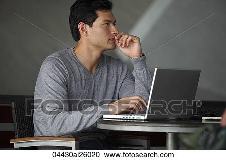 "side profile of man working on laptop, thinking" View Large Photo Image Stock Image - "side profile of man working on laptop, thinking". Fotosearch