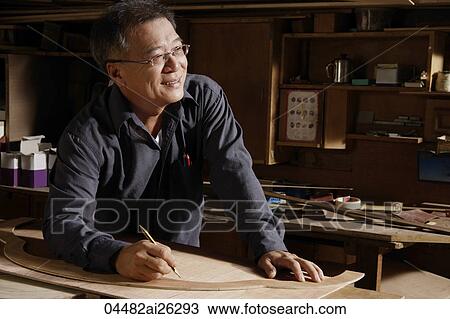 Carpenter working with wood. View Large Photo Image Stock Image - Carpenter working with wood.. Fotosearch
