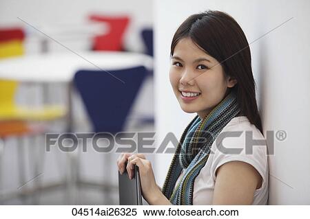 Chinese woman smiling at camera. View Large Photo Image Stock Photography - Chinese woman smiling at camera.. Fotosearch