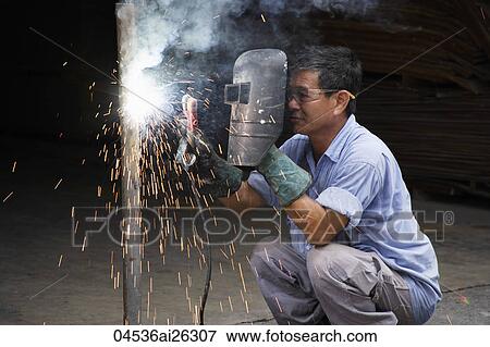 Mature man welding. View Large Photo Image Stock Photo - Mature man welding.. Fotosearch