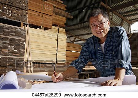 Mature man working in wood shop. View Large Photo Image Stock Photo - Mature man working in wood shop.. Fotosearch