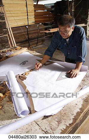 Mature man writing on drafting paper. View Large Photo Image Stock Image - Mature man writing on drafting paper.. Fotosearch