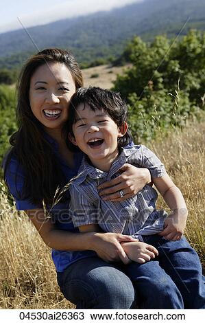 Mother and son giggling. View Large Photo Image Stock Image - Mother and son giggling.. Fotosearch
