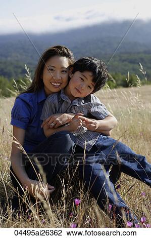 Mother and son hugging View Large Photo Image Stock Image - Mother and son hugging. Fotosearch