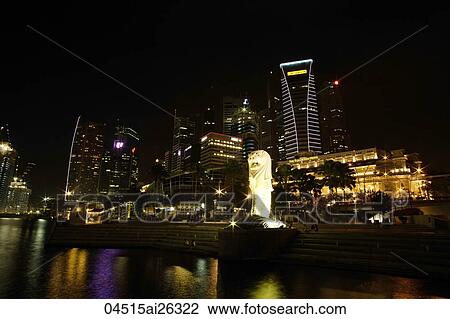 Stock Image - Night view of The Merlion and Shenton Way, Singapore. Fotosearch