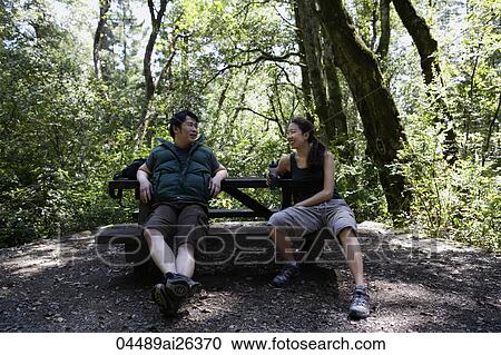 young couple resting during hike View Large Photo Image Stock Image - young couple resting during hike. Fotosearch