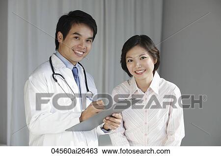 Doctor talking to female patient View Large Photo Image Stock Image - Doctor talking to female patient. Fotosearch