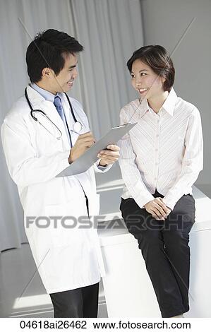 Doctor talking to patient View Large Photo Image Stock Image - Doctor talking to patient. Fotosearch