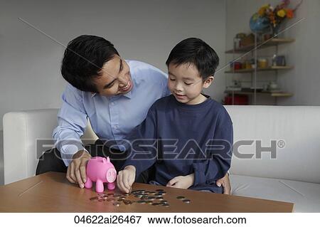 Father talking to young son about finances View Large Photo Image Stock Photo - Father talking to young son about finances. Fotosearch