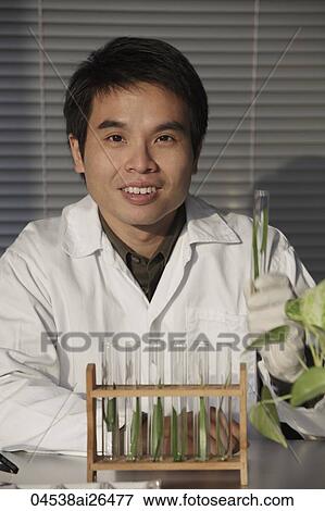 Scientist holding a test tube. View Large Photo Image Stock Photo - Scientist holding a test tube.. Fotosearch