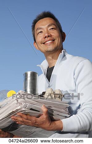 Chinese man carrying things to recycle View Large Photo Image Stock Photo - Chinese man carrying things to recycle. Fotosearch