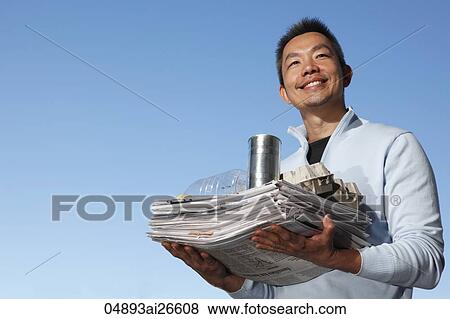 Stock Photo - Chinese man carrying things to recycle. Fotosearch
