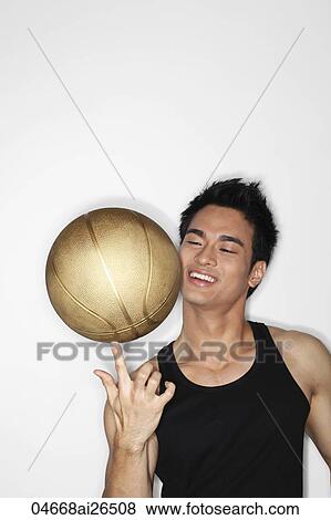 Chinese man playing with basket ball View Large Photo Image Stock Photo - Chinese man playing with basket ball. Fotosearch