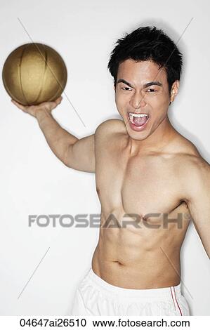 Chinese man playing with basketball with shirt off View Large Photo Image Stock Image - Chinese man playing with basketball with shirt off. Fotosearch