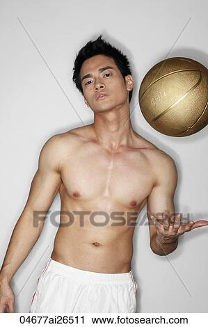 Chinese man playing with basketball with shirt off View Large Photo Image Stock Image - Chinese man playing with basketball with shirt off. Fotosearch