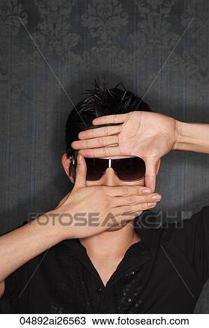 Chinese man wearing sunglasses, framing face with his hands View Large Photo Image Stock Image - Chinese man wearing sunglasses, framing face with his hands. Fotosearch