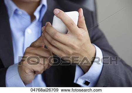 Close up of man using touch screen phone View Large Photo Image Stock Photo - Close up of man using touch screen phone. Fotosearch