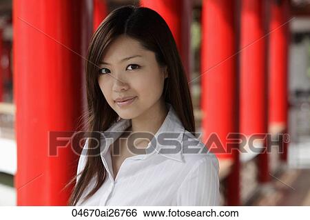Head shot of Chinese woman in front of red pillars View Large Photo Image Stock Photograph - Head shot of Chinese woman in front of red pillars. Fotosearch