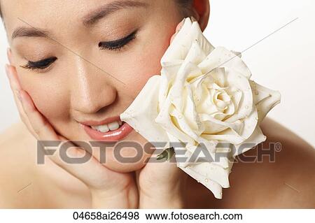 Head shot of Chinese woman looking down View Large Photo Image Stock Photo - Head shot of Chinese woman looking down. Fotosearch