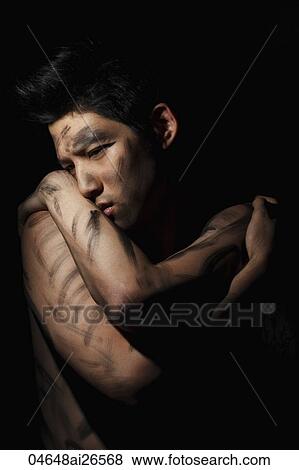 Portrait of Chinese man holding himself with markings on his body View Large Photo Image Stock Photo - Portrait of Chinese man holding himself with markings on his body. Fotosearch