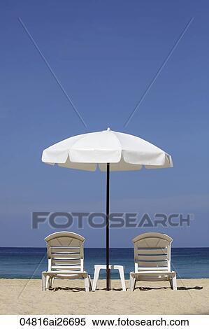White umbrella and chairs on beach View Large Photo Image Stock Photography - White umbrella and chairs on beach. Fotosearch