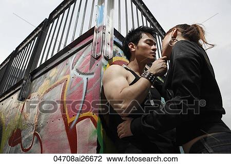 Stock Image - Young urban couple getting ready to kiss. Fotosearch