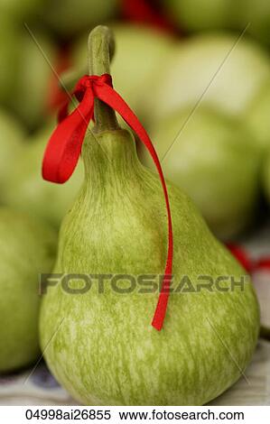 Stock Photography - Chinese guard tied with red ribbon symbolizes luck.. Fotosearch