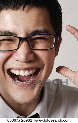 close up of young man wearing glasses and laughing View Large Photo Image Stock Image - close up of young man wearing glasses and laughing. Fotosearch