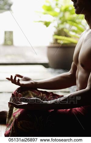 cropped shot of man meditating View Large Photo Image Stock Photo - cropped shot of man meditating. Fotosearch