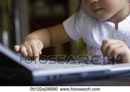cropped shot of young girl playing on lap top View Large Photo Image Stock Image - cropped shot of young girl playing on lap top. Fotosearch